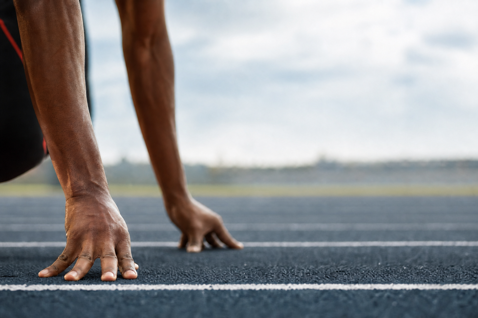 Athlete Crouching At Starting Line With Brand Colors